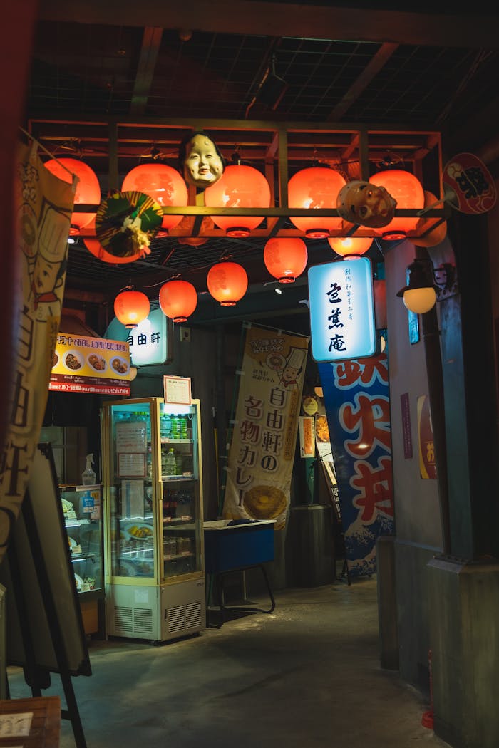 Cozy alley with glowing red lanterns and traditional decor in a Japanese town.